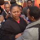 Jahi McMath's mother, Nailah Winkfield (center), and her uncle, Omari Sealey, moments after learning the most recent news about the teen's care
youtube